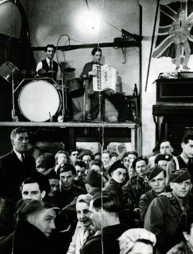 Historic photo of band on the Wall stage