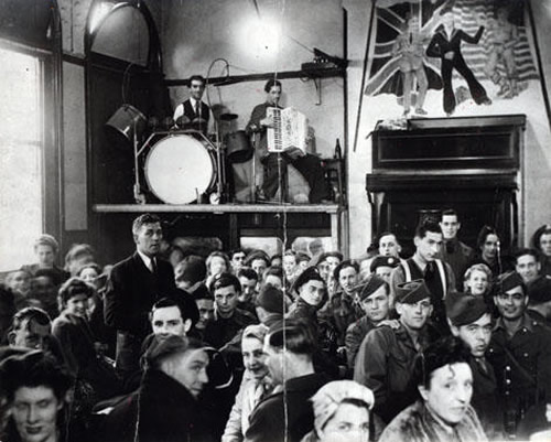 Figure 7 – Musicians on stage at Band on the Wall during World War II, probably Rudi Mancini, accordion, and Jim Hart, drums, c1943